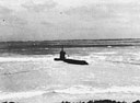 Japanese two-man midget submarine, grounded on the coral reef off Bellows Field