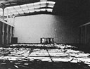 wall-to-wall debris covers the floor of the mess hall following the attack
