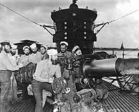 Photo # 80-G-33750:  Crememembers manning USS S-44's four-inch deck gun, January 1943