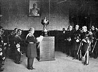 Photo # NH 41699: Japanese Minister of Marine accepting a loving cup presented to the Japanese Navy by the officers and men of the Great White Fleet