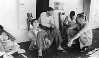 Photo # NH 80134: Crew members relaxing topside on USS Canopus, circa 1933-1934