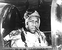 Photo # USN 1146845:  Ensign Jesse L. Brown in the cockpit of an F4U-4, circa 1950
