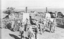 Jubilant at their success, South African infantrymen and armoured car crews walk through the gate of the compound at Hobok.