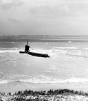 JAPANESE MIDGET SUBMARINE which ran aground on the beach outside Pearl
Harbor, 7 December. Early on the morning of 7 December at least one Japanese
submarine was reconnoitering inside Pearl Harbor, having slipped past the anti-
submarine net. After making a complete circuit of Ford Island the submarine left
the harbor and later ran aground on the beach where it was captured intact.