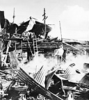 DESTROYED HANGAR AT HICKAM FIELD, 7 December. During the attack
the Army lost 226 killed and 396 wounded; the Navy, including the Marine
Corps, lost 3,077 killed and 876 wounded. The Japanese attack was entirely
successful in accomplishing its mission, and the U.S. forces were completely
surprised both strategically and tactically.