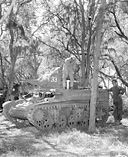 LIGHT TANK M3 being refueled during jungle maneuvers. This tank, which
replaced earlier light tank models, had as its principal weapon a 37-mm. gun.