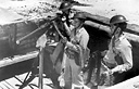 MEN CLEANING A 3-INCH ANTIAIRCRAFT GUN M3 (top); members of a machine
gun crew operating a Browning machine gun HB .50-caliber, flexible (bottom).