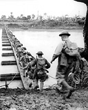 TROOPS CROSSING the newly constructed pontoon bridge.