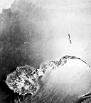 AERIAL VIEW OF CORREGIDOR ISLAND off the tip of Bataan. On 25
December, Headquarters, United States Army Forces in the Far East, was established
on Corregidor. Manila was declared an open city on the following day and
the remains of the naval base at Cavite were blown up to prevent its supplies
from falling into enemy hands.