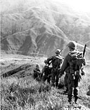 U.S. TROOPS moving through mountainous terrain on their way to Santa Fe, Luzon