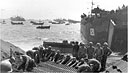 STEEL MATTING BEING LAID on the beach at Iwo Jima to facilitate the unloading of heavy equipment