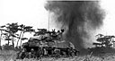 MEDIUM TANK M4A1 AND INFANTRYMEN blasting their way through a minefield