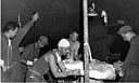 medics at work in a hospital tent