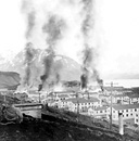 DUTCH HARBOR, ALASKA, with buildings burning after the Japanese bombing 
of June 1942. On 3 and 4 June the Japanese attacked the Army installations
there. Of the two bombings, the first resulted in little damage, but the second
considerably damaged ground installations. On 4 June the Japanese landed a
battalion on Attu, and on the 6th troops landed on Kiska. Since most of the
available U.S. ships, planes, and trained troops were needed in other areas, no
immediate action was begun to recapture Attu and Kiska. Both the United States
and Japan learned that, because of the extremely bad weather conditions, this
area was one of the most unsuitable in the world for combat operations and the
Aleutians were not used as an important base for operations.