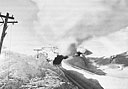 TRAIN PLOWING THROUGH DEEP SNOW on the White Pass and Yukon Route railroad