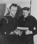 COAST GUARDSMEN KELSIE K. KEMP, SEAMAN, FIRST CLASS, LEFT, OF BARRON SPRINGS, VIRGINIA, AND GEORGE S. KENNEDY, SEAMAN, FIRST CLASS, OF SAN MARCOS, TEXAS, THE ONLY SURVIVORS OF 198 OFFICERS AND MEN WHO WERE ABOARD WHEN THE COAST GUARD MANNED USS SERPENS CARRYING A CARGO OF AMMUNITION WAS LOST BY AN EXPLOSION OF UNDETERMINED ORIGIN, LATER EVALUATED NOT ENEMY ACTION, AS IT LAY ANCHORED APPROXIMATELY A MILE FROM THE GUADALCANAL SHORE ON JANUARY 29, 1945