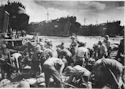 COAST GUARD MANNED LST-18 UNLOADS ITS FIGHTING MEN AND MACHINES ON THE BEACHES OF LEYTE