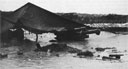105mm Howitzer of the 15th Marines is swamped, but still in firing order after ten days of rain