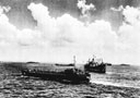 Landing craft and transports busy at Saipan
