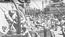 Ammunition ship Shasta loading 14-inch powder and shells onto the New Mexico