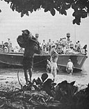 PT's nose up on beach for unloading of camp gear to set up advance base at Amsterdam Island