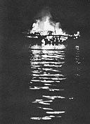 A Japanese lugger in flames off the coast of Cebu