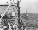 Sands (DD-243) comes alongside Neches (AO-5) to receive fuel while under way. (Naval Historical Center)