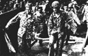 Figure 75.--Carryiing wounded aboard a landing boat for further transportation to an APA or hospital ship.