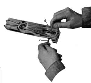 Removing the cocking lever.