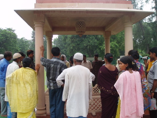 Crowd of visitors to the Pillar hear a lecture