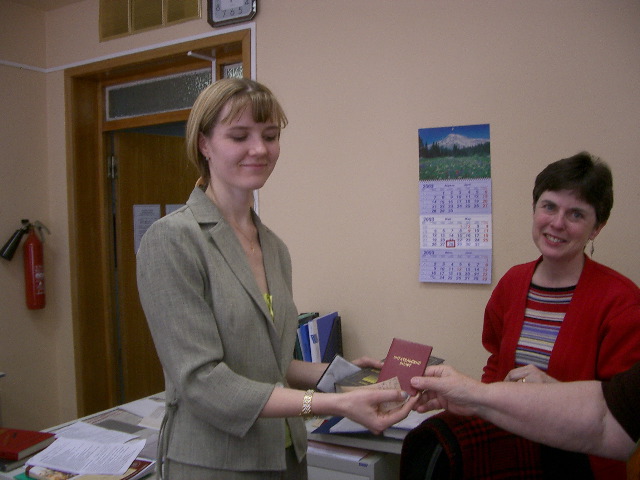 MGIMO Marketing School Scientific Research Center (aka Library) Director holds a postport to reading (with Evelyn's arm and Barbara's smile) 