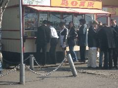 Grads in line (note girl in apron and sash with white hankies in hair)