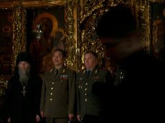 Priest and Kazakstani delegation in front of altar of the Refectory and Church of St Sergei