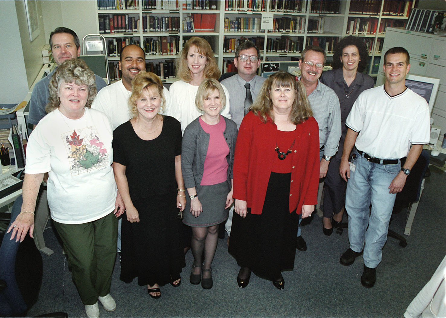 The staff of the Sun-Sentinel pose in the library