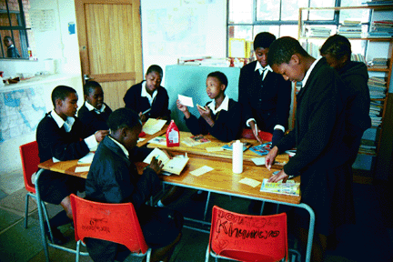 Students at Nottingham Road Combined School share in the work of processing and cataloging books. In so doing, they take ownership of the library.