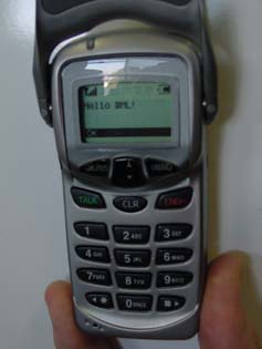 A Sprint cell phone showing the words "Hello WML"