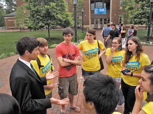 Bruce Niles, head of the Sierra Club's national Beyond Coal campaign, congratulates student organizers at Tuesday's announecment.