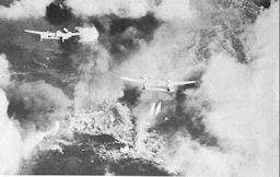 Image: P-38's Droping Napalm Near Ipo Dam