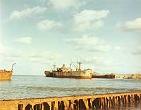 Photo # USA C-6343:  USS Inca and USS LST-823 aground at Okinawa circa the late 1940s.