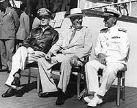 Photo # 80-G-241479:  General MacArthur, President Roosevelt and Admiral Nimitz on board USS Baltimore, 26 July 1944
