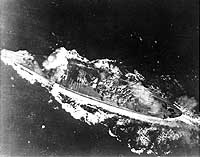 Photo # 80-G-325952: Japanese battleship Yamato is hit by a bomb during the Battle of the Sibuyan Sea, 24 October 1944.