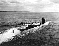 Photo # 80-G-43874:  USS O-2 diving during training operations, 26 November 1943