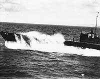 Photo # 80-G-456140:  USS Shark plows through the waves, circa the later 1930s