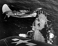 Photo # 80-G-469319:  SB2C aircraft over USS Hornet, January 1945