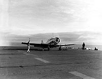 Photo # 80-G-66744:  SNJ-3 aircraft preparing to take off from USS Long Island, January 1943