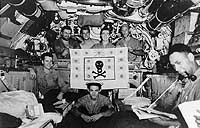 Photo # 80-G-72010:  USS Plunger crewmen display her battle flag in a photo dated 21 June 1943