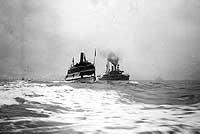 Photo # NH 41686:  Excursion steamer General Lee passes a line of Atlantic Fleet ships in Hampton Roads, Virginia, 22 February 1909