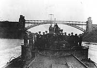 Photo # NH 41767:  Officers, crewmen and a former prisoner of war on the foredeck of U-152, in the Kiel Canal, November 1918