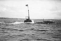 Photo # NH 44576:  USS Octopus surfacing during preliminary trials, July 1907