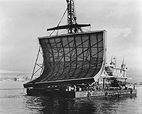 Photo # NH 45464: Transporting a large patch used in an attempt to seal USS Nevada's torpedo damage, January 1942.